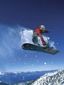 A snowboarder, somewhere over Heavenly Mountain Resort in California.