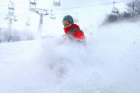 Boarding through powder at Ski Beech, North Carolina.